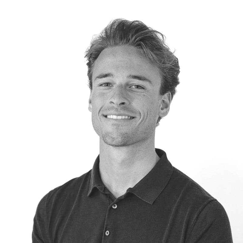 Black-and-white portrait of Arend Verschueren in a dark polo shirt, facing forward.