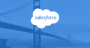Salesforce logo in a white cloud over a blue-tinted image of the Golden Gate Bridge in San Francisco.