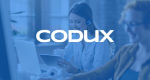 Logo of Codux over an image of two customer service employees working at a desk.