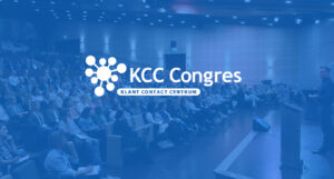 Image of a seminar with blue overlay, with the logo on it of KCC Congres